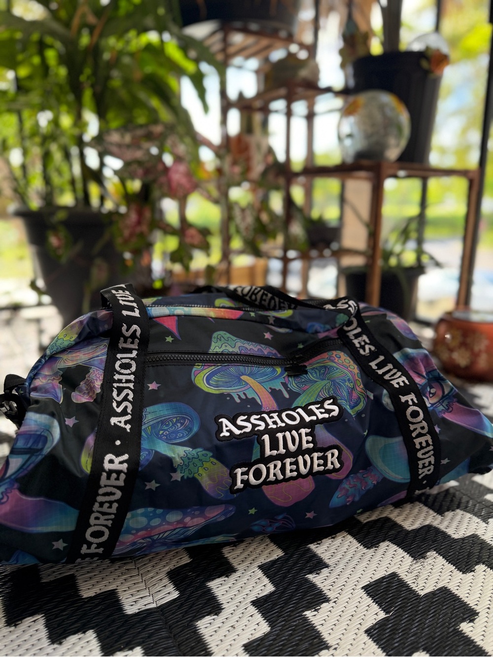 Embroidered ALF Graphic Black Travel Duffle Bag with Multicolor Mushroom Print